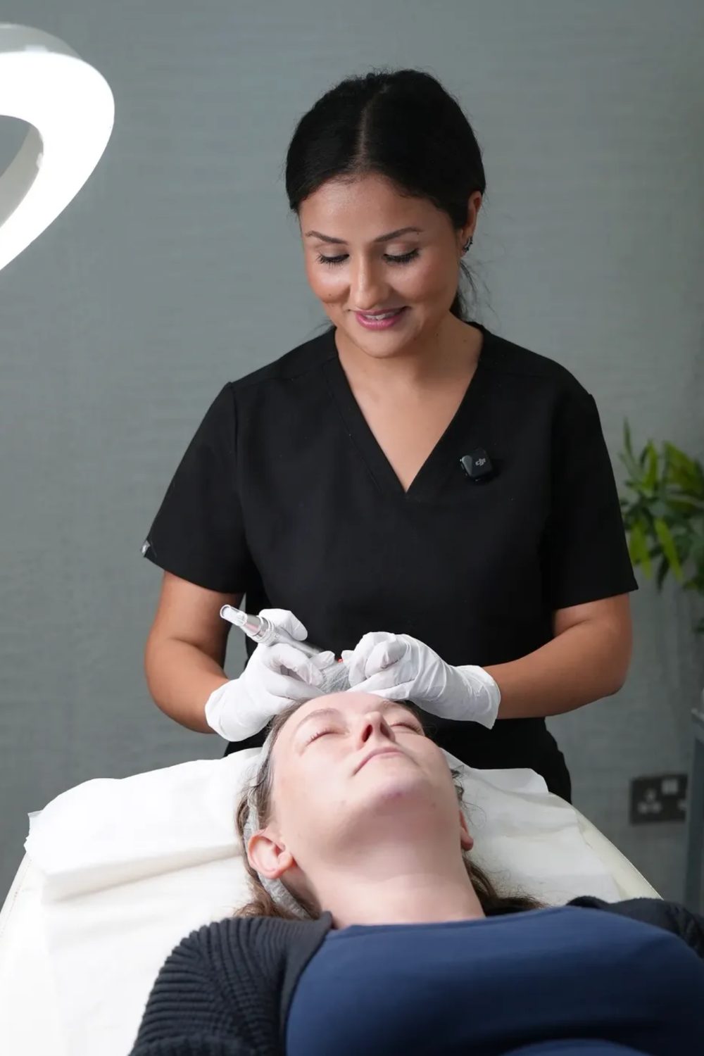 A clinician carrying out a doctor-planned skin treatment at Aarva