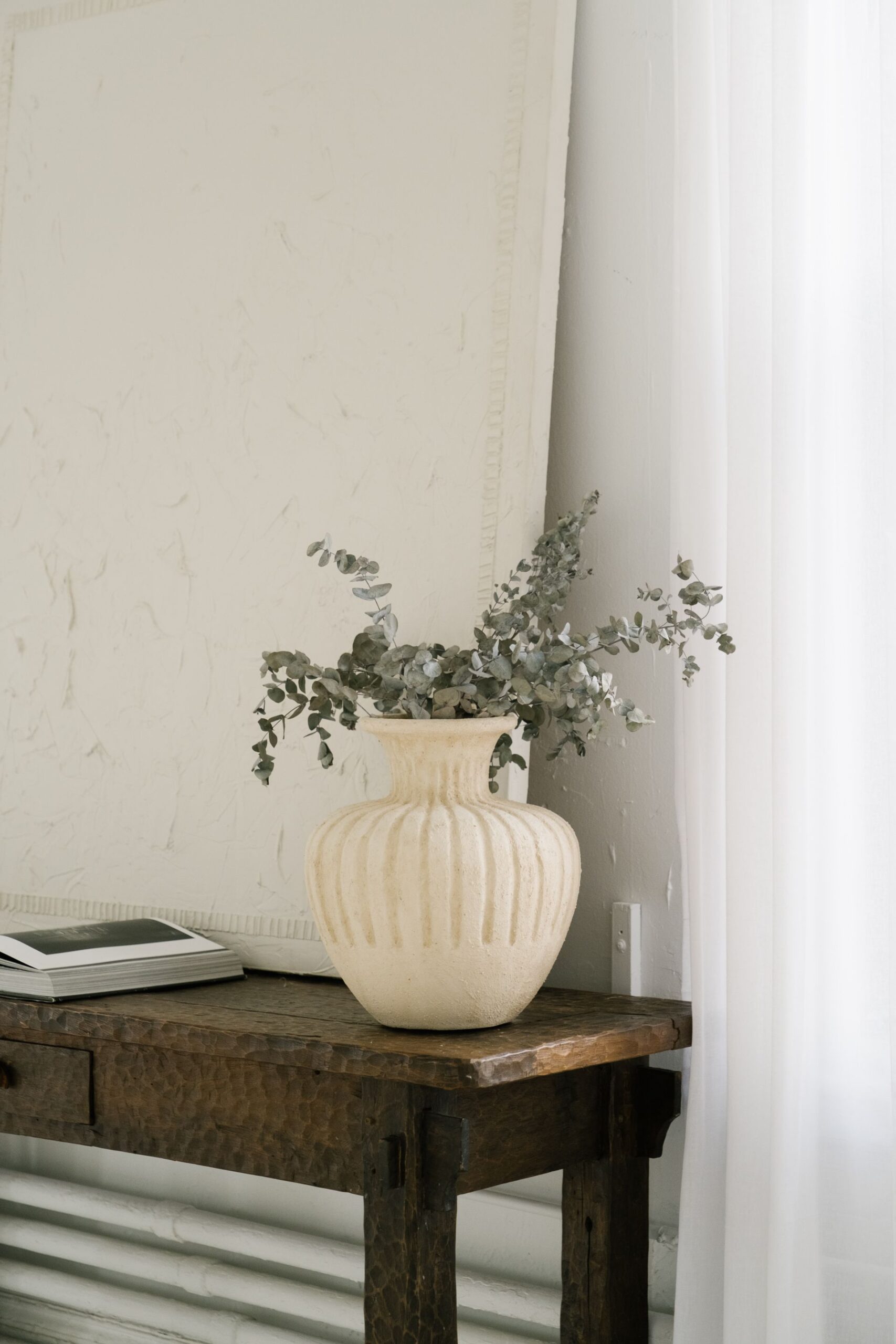 Eucalyptus in a cream vase