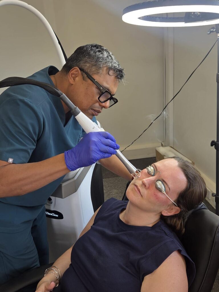 Dr Saptarshi Saha treating a patient with the UltraClear laser at Aarva, Sutton Coldfield